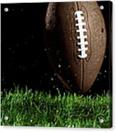 Football In Motion Over Grass Acrylic Print