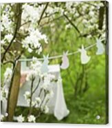 Garland Of Bunnies Between Blossoming Fruit Trees And Set Table In Background Acrylic Print