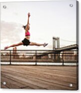 Woman Doing Splits In Mid-air Over Promenade Against Sky Acrylic Print