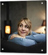 Portrait Of Smiling Woman Relaxing On Couch At Home In The Evening #2 Acrylic Print