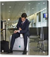 A Businessman Waiting In The Departure Lounge. Acrylic Print