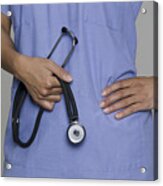 A Female Medical Professional Holds Her Stethoscope In Her Hands Acrylic Print