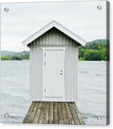 A Hut At The End Of A Wooden Lake Pier. Acrylic Print
