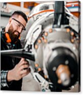 Aircraft Engineer Repairing A Small Front-engine Airplane Disassembled In A Hangar Acrylic Print