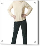 An Adult Caucasian Woman In Black Pants And A Tan Sweater Puts Her Hands On Her Hips As She Smiles Acrylic Print