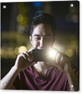 Asian Man Using His Smart Phone To Take A Photo At Night. Acrylic Print