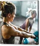 Athletic Woman Exercising With Kettle Bell On A Class In A Health Club. Acrylic Print