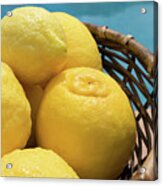 Bright Yellow Lemons In A Basket By The Pool Acrylic Print