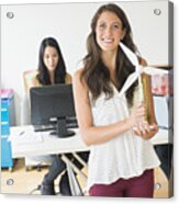 Businesswoman Holding Wind Turbine Model In Office Acrylic Print