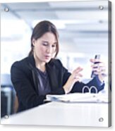 Businesswoman Using Smartphone In Office Acrylic Print
