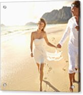 Caucasian Couple Running On Beach Acrylic Print