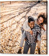 Cheerful African American Couple Piggybacking In Autumn At The Park. Acrylic Print