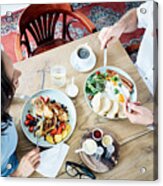 Cheerful Couple Having Breakfast In Cafe And Talking. People Eating Together Acrylic Print