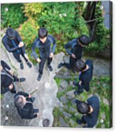 Directly Above View Of A Group Of Men Wearing Wet Suits Before A River Rafting Tour Acrylic Print