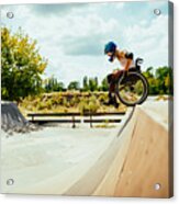 Disabled Millennial Woman In Wheelchair Rolls Down The Hills In Skate Park Acrylic Print
