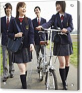 Four Students In Uniform Walking Outdoors, One Holding A Bicycle Acrylic Print