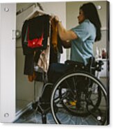 Full Length Side View Of Young Disabled Woman Looking At Clothes Hanging In Wardrobe Acrylic Print