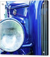 Grill And Headlight With A Blue Car Attached Acrylic Print