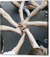 Group Of Athletes Bring Hands Together In Unity Before Friendly Outdoor Basketball Match Acrylic Print