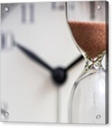 Hourglass On The Background Of Office Watch As Time Passing Concept For Business Deadline, Urgency And Running Out Of Time. Sand Clock, Business Time Management Concept Acrylic Print