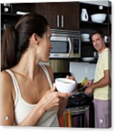 Man And Woman Preparing Breakfast And Smiling At One Another Acrylic Print