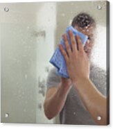 Man Cleaning A Mirror In A Bathroom Acrylic Print