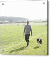 Man Walking In Countryside With Pet Dog Acrylic Print