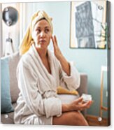 Mature Woman Applies Face Moisturizer And Beauty Mask On Her Face Acrylic Print