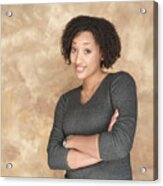 Portrait Of A Young African American Woman In A Grey Sweater As She Folds Her Arms And Smiles Acrylic Print