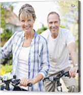 Portrait Of Smiling Senior Couple On Bicycles Acrylic Print