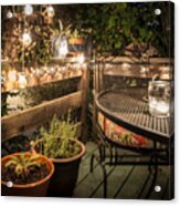 Potted Plants By Table And Chair In Illuminated Back Yard Acrylic Print