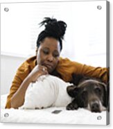 Sad Woman Lying On Bed With Dog Acrylic Print