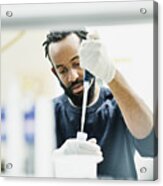 Scientist pipetting samples in research lab Acrylic Print