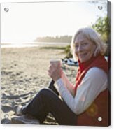Senior Woman Camping On Beach With Coffee Acrylic Print