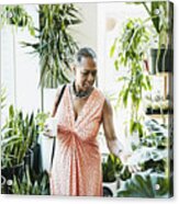 Senior Woman Touching Plant Leaf While Shopping In Plant Store Acrylic Print