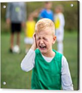 Small Boy In Pain Crying Outdoors On Football Pitch. Acrylic Print