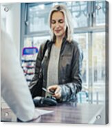Smiling Customer Making Payment Through Mobile Phone At Checkout Counter In Chemist Shop Acrylic Print