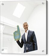 Smiling Mature Businessman Holding Toy Hand In Office Acrylic Print