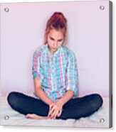 Teenage Girl Looking At Mobile Phone While Sitting On Bed Against Wall Acrylic Print
