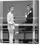 Two Businesswomen Behind Large Glass Window, B&w Acrylic Print