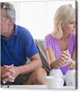 Usa, New Jersey, Portrait Of Couple Sitting On Sofa, Looking Away From Each Other Acrylic Print