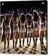 View From Behind Of Cheerleaders Cheering With Pompoms In Air Acrylic Print