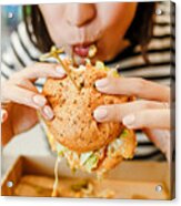 Woman Eating A Hamburger In Modern Fastfood Cafe, Lunch Concept Acrylic Print
