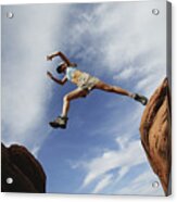Woman Jumping Over Rock Ledge Acrylic Print