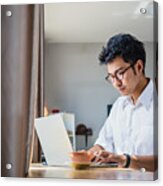 Young Asian Business Man Working With Laptop Computer While Sitting In Coffee Shop Cafe Acrylic Print