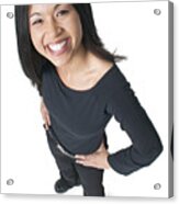 Young Attractive Asian Woman Dressed In Black Puts Her Hands On Her Hips And Smiles Up To The Camera Acrylic Print