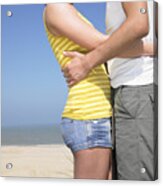 Young Couple Embracing At Beach. Acrylic Print