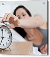 Young Woman Reaching For Alarm Clock Acrylic Print