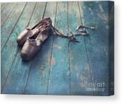 Worn Ballet Shoes on Wooden Floor Canvas Print