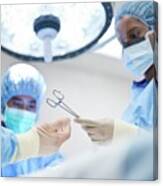 Nurse Passing Surgical Scissors To Surgeon #2 Canvas Print